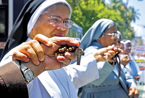 Priests and nuns under Ernakulam-Angamaly archdiocese forming a human chain from Vanchi Square to Menaka Junction in Kochi to express solidarity with the people of Manipur | A Sanesh