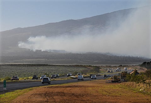 Smoke blows across the slope of Haleakala volcano on Maui, Hawaii, as a fire burns in Maui's upcountry region on Tuesday. (Photo | AP)