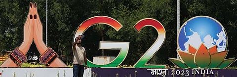 A man takes a selfie in front of an installation built for the upcoming G20 Summit in New Delhi on Thursday | Shekhar Yadav