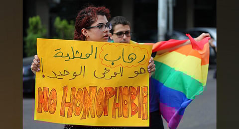 Supporters of the LGBTQ+ community attend a sit-in to protest the ongoing criminalization of homosexuality and arbitrary arrests in front of Hobeich police station in Beirut. (File photo | AP)