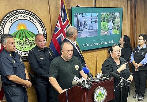 Hawaii Gov. Josh Green, center, speaks at a news conference in Wailuku, Hawaii, Aug. 12, 2023, about wildfires that tore through Lahaina on the Hawaiian island of Mauii. (Photo | AP)