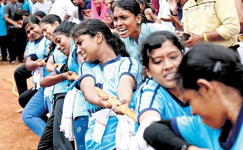 Participants at the tug-of-war competition organised to promote road safety initiatives. Students, celebrities and MVD officials participated in the contest held at St George School. (Photo | Express)