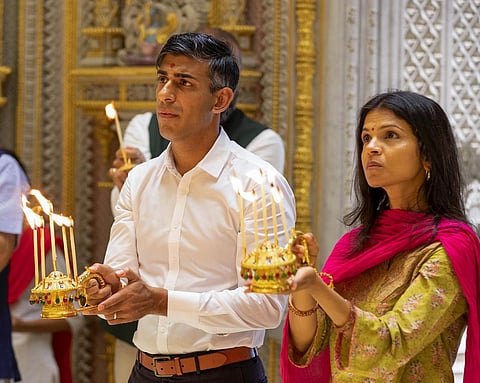 UK Prime Minister Rishi Sunak and his wife Akshata Murthy offer prayers at the Akshardham Temple, in New Delhi, on Sept. 10, 2023. (PTI)