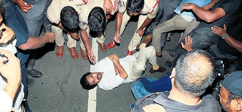 Jana Sena Party chief Pawan Kalyan lying on the road at Anumanchipalle in NTR district on Saturday night when police prevented him from going to Mangalagiri | Express