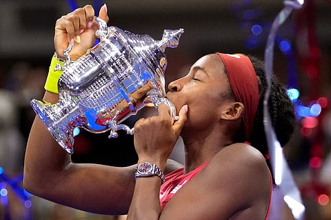 Coco Gauff kisses the championship trophy after defeating Aryna Sabalenka in the women's singles final of the U.S. Open tennis championships. (Photo | AP)