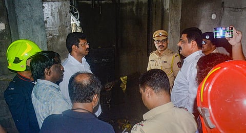 Police personnel and other officials at the spot after a lift in a building collapsed, in Thane, Sunday, Sept. 10, 2023. (Photo | PTI)