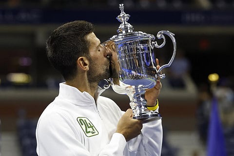 Serbia's Novak Djokovic kisses the trophy after defeating Russia's Daniil Medvedev during the US Open tennis tournament men's singles final match. Photo | AFP)