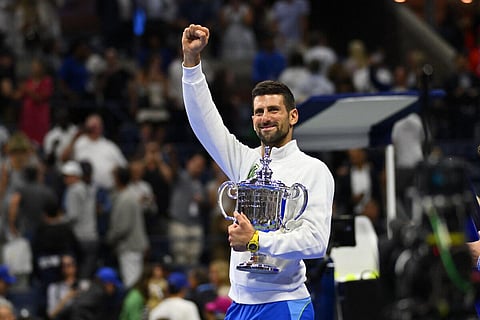 Serbia's Novak Djokovic holds the trophy after defeating Russia's Daniil Medvedev in the US Open tennis tournament men's singles final match. (Photo | AFP)