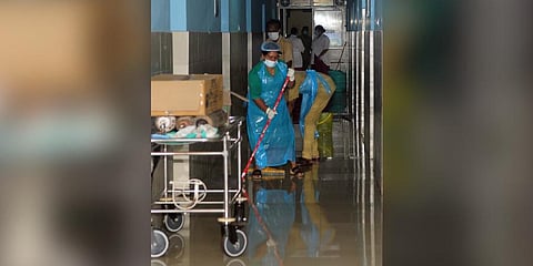Healthcare workers cleaning and sanitising an isolation ward of Kozhikode Medical College Hospital following the outbreak of Nipah. (Photo | E Gokul, EPS)