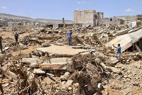 Floodwaters washed down Wadi Derna, a valley that cuts through the city, crashing through buildings and washing people out to sea. (Photo | AP)
