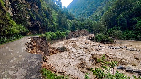 FILE PHOTO: A section of a road washed away after the heavy monsoon rainfall, at Gadsa Valley in Kullu, Tuesday, July 25, 2023. (PTI)