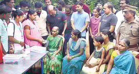 A team headed by Health Minister M Subramanian at a medical camp at Cinchona tribal hamlets in Coimbatore district on Thursday | Express