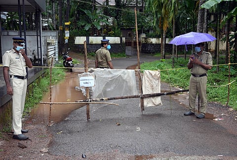 Police deployed at the containment zone at kuzhubil kooniyodu road. (Photo | E Gokul)