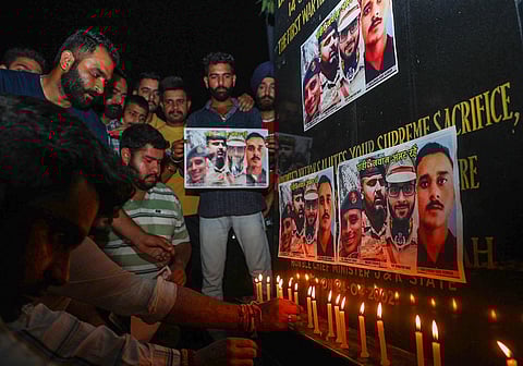 Tributes being paid to Col Manpreet Singh, Major Ashish Dhonchak and DSP Humayun Bhat who were killed in Anantnag. Photo of Rifleman Ravi Kumar killed in Rajouri is seen too. (PTI)