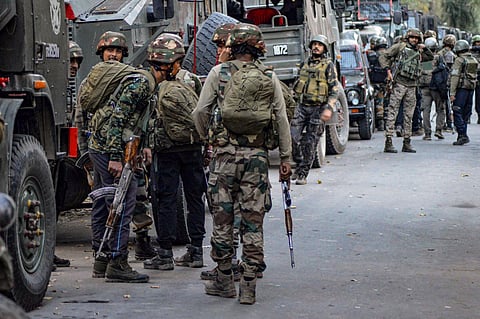 Security forces personnel at a search operation in the cordoned-off area during the ongoing encounter with terrorists in the Kokernag area, in Anantnag district on Sept. 15, 2023. (PTI)
