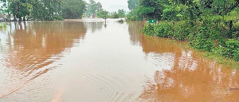 The submerged bridge at MV-96 in Malkangiri’s Kalimela and the house which collapsed at Harekrushnapur in Kalahandi leaving one dead | Express