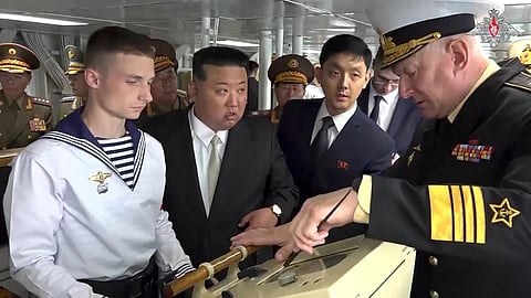 North Korea's leader Kim Jong Un listens to explanations by Admiral Nikolai Yevmenov, Commander-in-Chief of the Russian Navy while visiting the Admiral Shaposhnikov frigate. (Photo | AP)