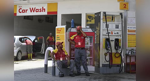 FILE - An image of petrol station employees waiting for customers in Rawalpindi, used for representational purposes only. (Photo | AFP)