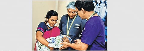 Dr Meghana, who led the Paediatric surgical team with the parent | Express