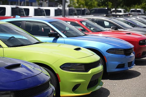 Unsold 2023 Charger sedans and Challenger hardtops sit at a Dodge dealership on June 18, 2023. (File Photo | AP)