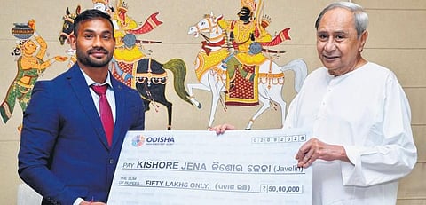 Chief Minister Naveen Patnaik felicitating Kishore in Bhubaneswar after his return from the championship | Express