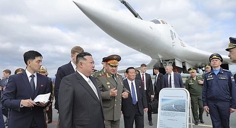 NorthKorean leader Kim Jong Un, front center, with Russian Defense Minister Sergei Shoigu, center right, visits an airport to see military planes near the port city of Vladivostok. (Photo | AP)