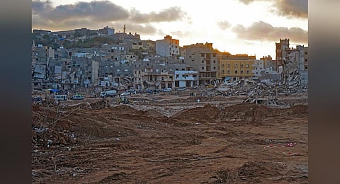 People search destroyed buildings in the aftermath of a devastating flood in eastern Libya's city of Derna, on September 16, 2023. (Photo | AFP)