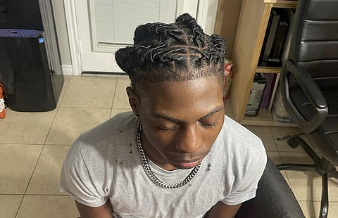 Darryl George, 17, sits for a photo showing his locs, at the family's home, Sept 10, 2023. (Photo | AP)