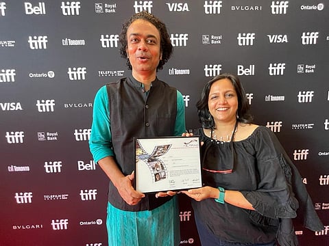 Director Jayant Digambar Somalkar and producer Shefali Bhushan of 'Sthal' with the NETPAC Award at TIFF 2023. (Meenakshi Shedde Twitter)