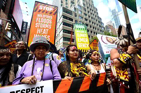 Climate activists march protesting energy policies and the use of fossil fuels, in New York on September 17th. (Photo | AP)