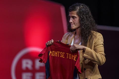 Spain's new women's national team coach Montse Tome, holds a jersey during her official presentation at the Spanish soccer federation headquarters in Las Rozas. (Photo | AP)