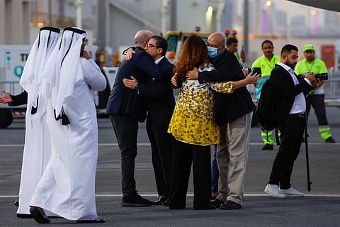 US citizens Siamak Namazi and Morad Tahbaz are greeted upon their arrival at the Doha International Airport in Doha on September 18. (Photo | AFP)