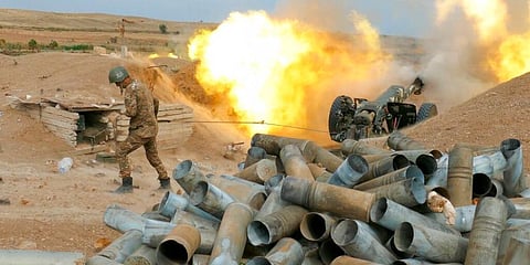 An Armenian soldier fires an artillery piece during fighting with Azerbaijan's forces in self-proclaimed Republic of Nagorno-Karabakh in 2020. (Photo | AP)