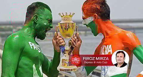 Fans with their bodies painted as national flags of India and Pakistan hold a cut-out of the Asia cup trophy in Ahmedabad on September 1, 2023. (Photo | AFP)