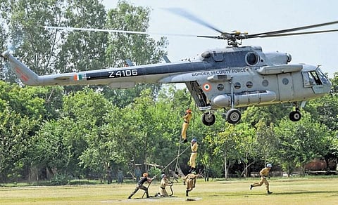 Trainee commandos during the helicopter slithering session held on Friday. (Photo | PTI)