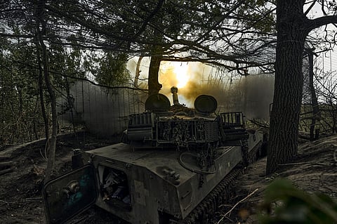 A Ukrainian self-propelled artillery system fires towards the Russian positions at the front line near Bakhmut, Donetsk region, Ukraine on Friday. (Photo | AP)