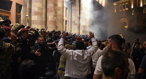 Protesters clash with police as they call on Armenian Prime Minister Nikol Pashinyan to resign in central Yerevan. (Photo | AFP)
