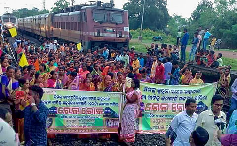 FILE | Agitators from the Kurmi community block railway tracks to press for their demand for Scheduled Tribe (ST) status, in Mayurbhanj district on September 20, 2022. (Photo | PTI)