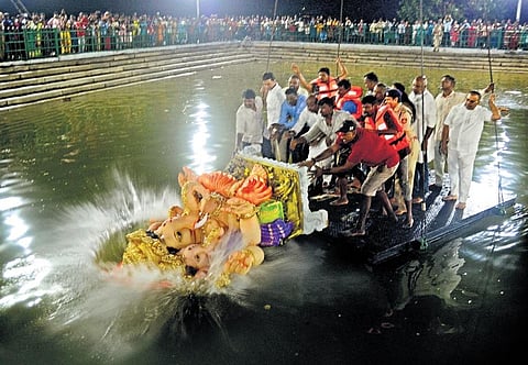 A Ganesha idol being immersed in Ulsoor lake. (Photo | Nagaraja Gadekal, Express)