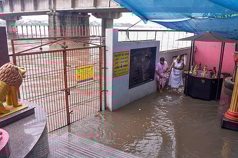 A flooded temple at the bank of the Tapi river after release of water from the Ukai Dam, in Surat. (PTI)