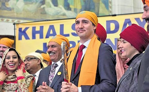 Members of the Sikh community with Trudeau during a Vaisakhi Celebration in Ottawa