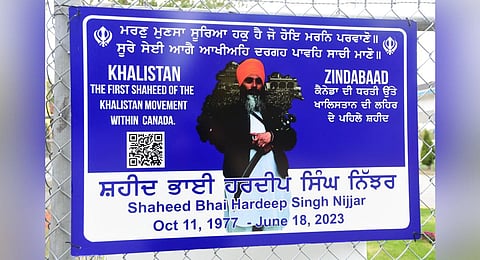A poster of Khalistan separatist Hardeep Singh Nijjar is displayed on a fence outside the Guru Nanak Sikh Gurdwara temple in Surrey, British Columbia, September 19, 2023. (Photo | AFP)