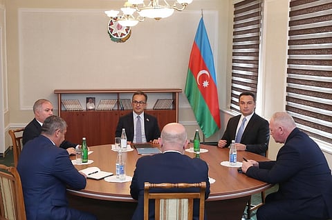 Representatives of the Armenian community of Karabakh, Azerbaijan's govt and a representative of the Russian peacekeeping contingent attend the talks in the Azerbaijani city of Yevlakh. (Photo | AP)