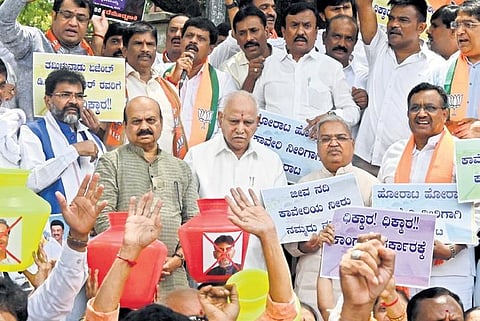 Former CMs BS Yediyurappa and Basavaraj Bommai and other BJP leaders protest at SBM Circle in Bengaluru on Saturday | Shashidhar Byrappa