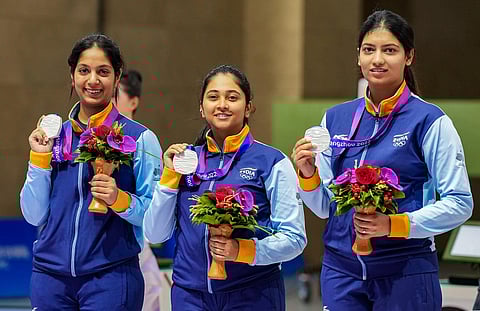 Indian women shooters Ramita Jindal (L), Mehuli Ghosh (C) and Ashi Chouksey stand at the podium after winning silver medal in 10m air rifle during the 19th Asian Games. (PTI)