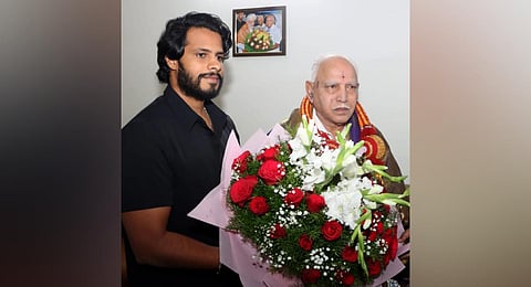 JDS youth wing leader Nikhil Kumaraswamy greets former CM BS Yeddiyurappa in Bengaluru on Sunday.