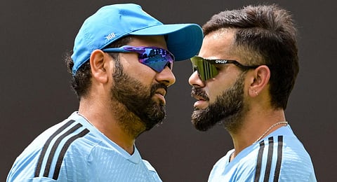 India's captain Rohit Sharma (L) talks with teammate Virat Kohli during a practice session.(Photo | AFP)