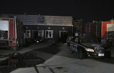 Security forces gather at the site of a fatal fire in the district of Hamdaniya, Nineveh province, Iraq, Wednesday, Sept. 27, 2023. (AP)