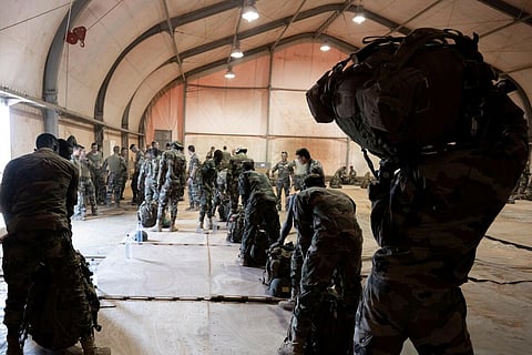 French soldiers of the 2e Regiment Etranger de Parachutistes (2eREP - 2nd Foreign Parachute Regiment ) and Nigerien soldiers prepare for a mission on the French BAP air base, in Niamey. (Photo | AFP)