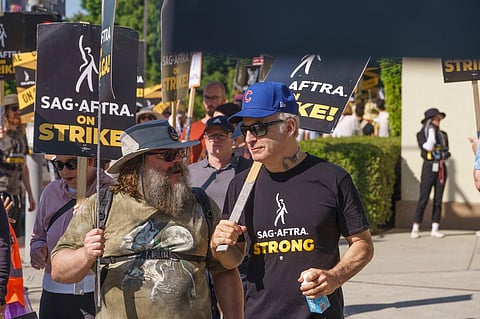 Actors Jack Black, left, and Bob Odenkirk join demonstrators outside the Paramount Pictures Studio in Los Angeles on Tuesday, September 26, 2023. (Photo | AP)